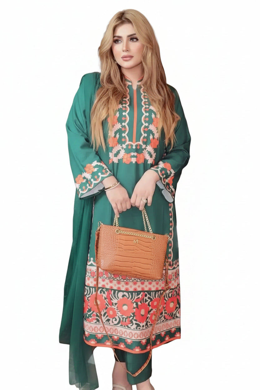 Woman in a green and floral dress holding a brown handbag in front of a black car.