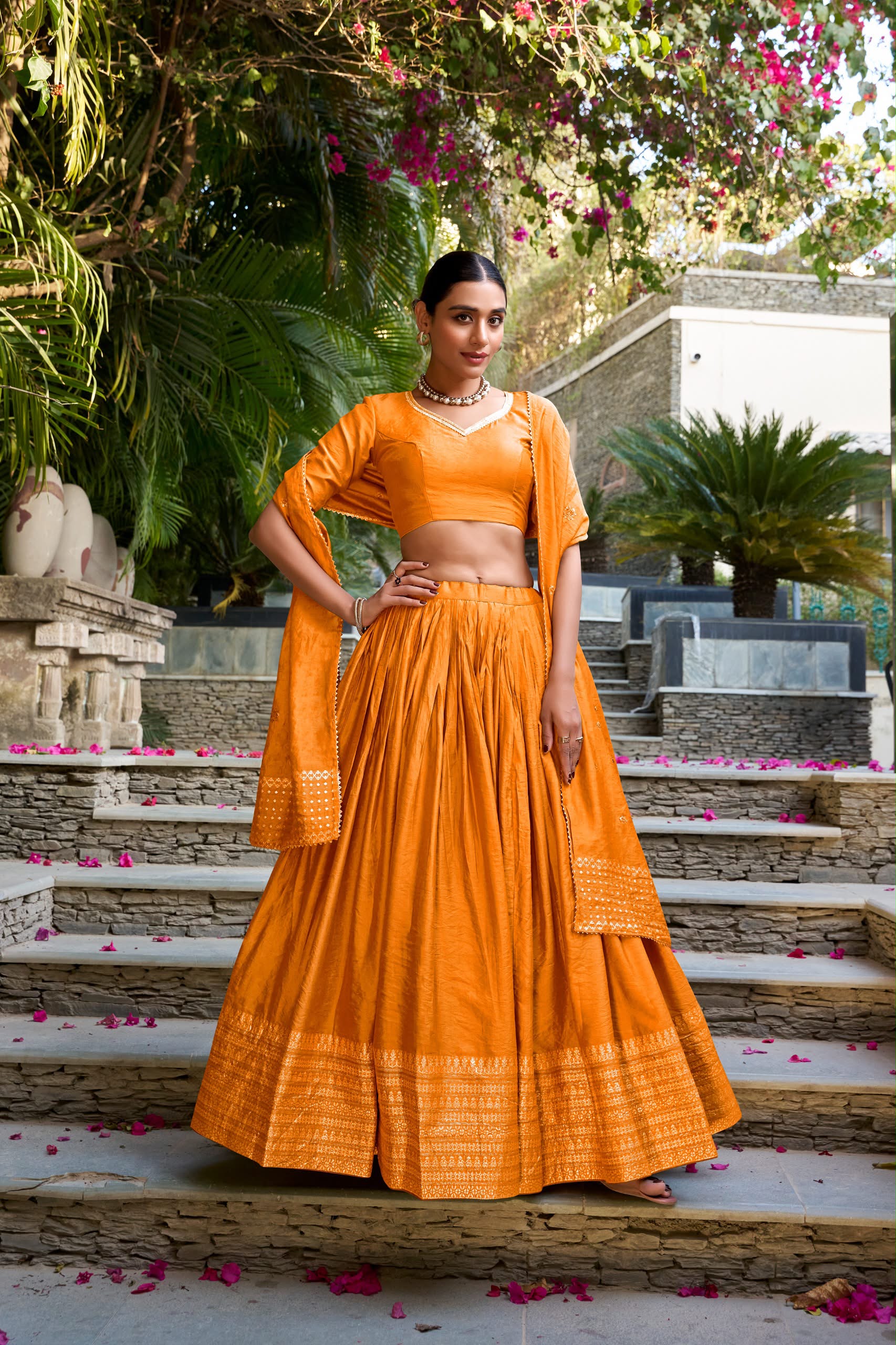 Crafted for Grace and Beauty: Pure Chanderi Plain Lehenga with Intricate Zari Work Border, Accompanied by Sequin Embellished Dupatta